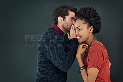 Buy stock photo Business, man and woman with gossip, news and speaking against a dark studio background. Female person, happy male employee and staff with discussion, secret and privacy with trust, chat and story