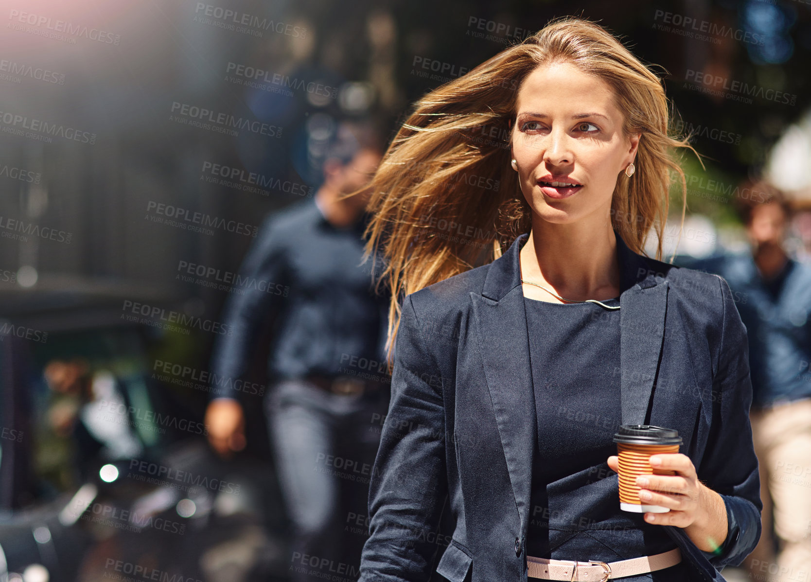 Buy stock photo Shot of a confident and stylishly dressed businesswoman walking down the street