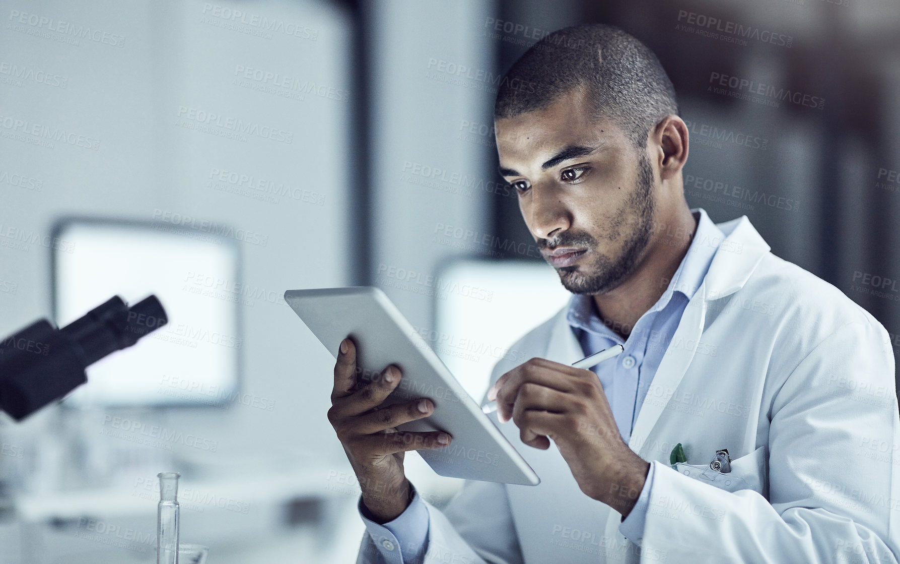 Buy stock photo Science, technology and medical research with a male scientist in the scientific innovation and development industry. Lab technician working on a tablet, making breakthrough and discover in medicine