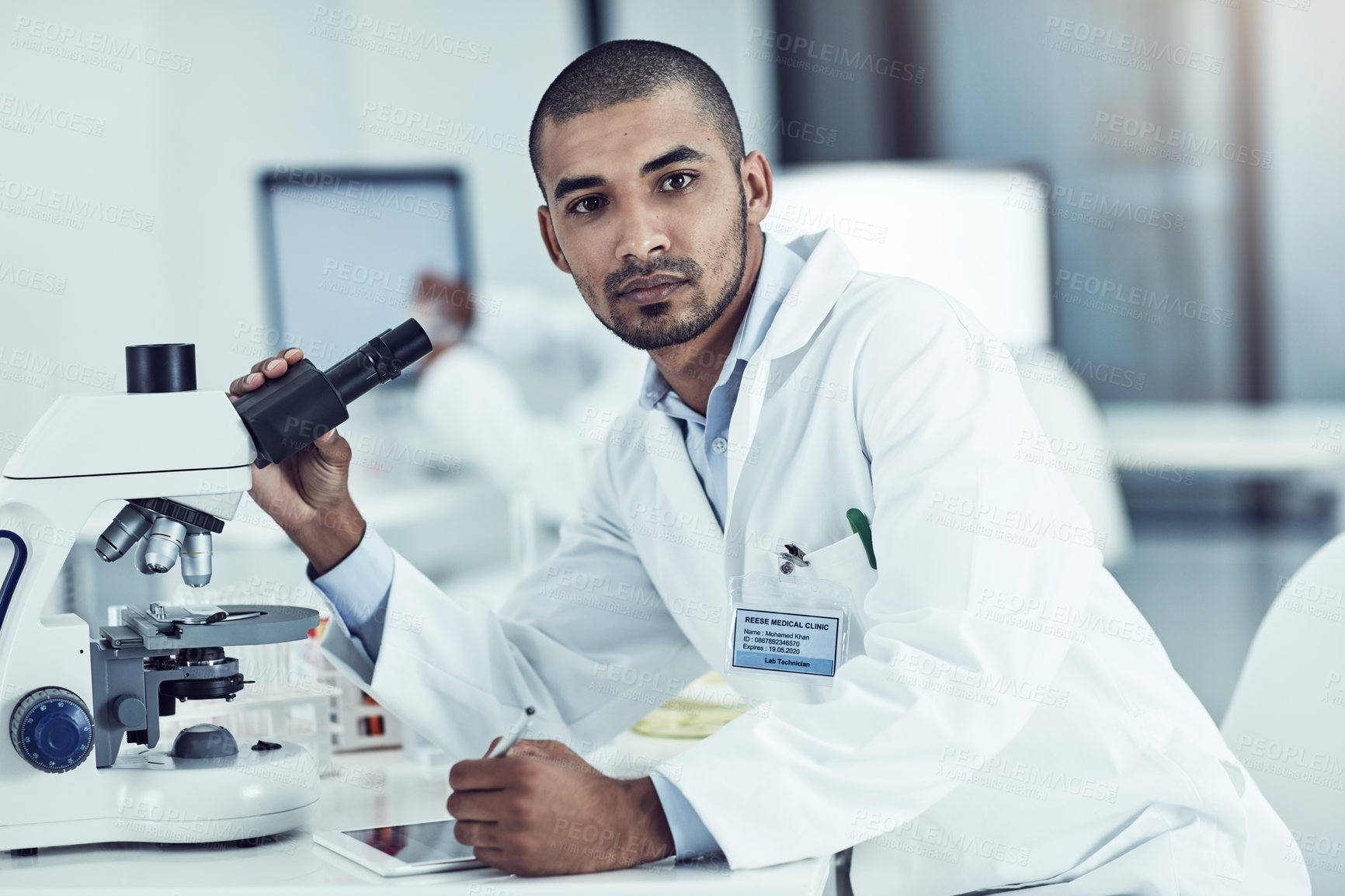 Buy stock photo Vision, discovery and thinking scientist leading with innovation and modern science in lab. Portrait of young biologist analyzing medical sample with microscope, on mission for cancer or corona cure