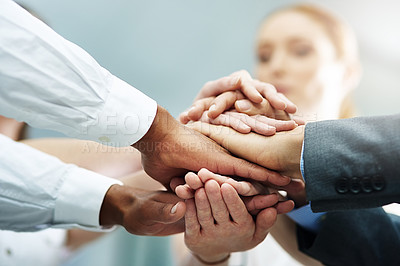 Buy stock photo Cropped shot of a group of businesspeople's hands in a huddle