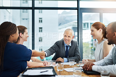 Buy stock photo Business people, meeting and boardroom with handshake agreement for b2b merger, welcome or deal. Men, women and diversity in office for corporate collaboration or employment, promotion or thank you