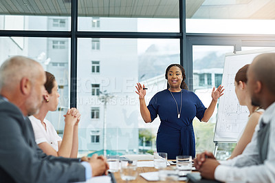 Buy stock photo Cropped shot of a young businesswoman giving a presentation in the boardroom