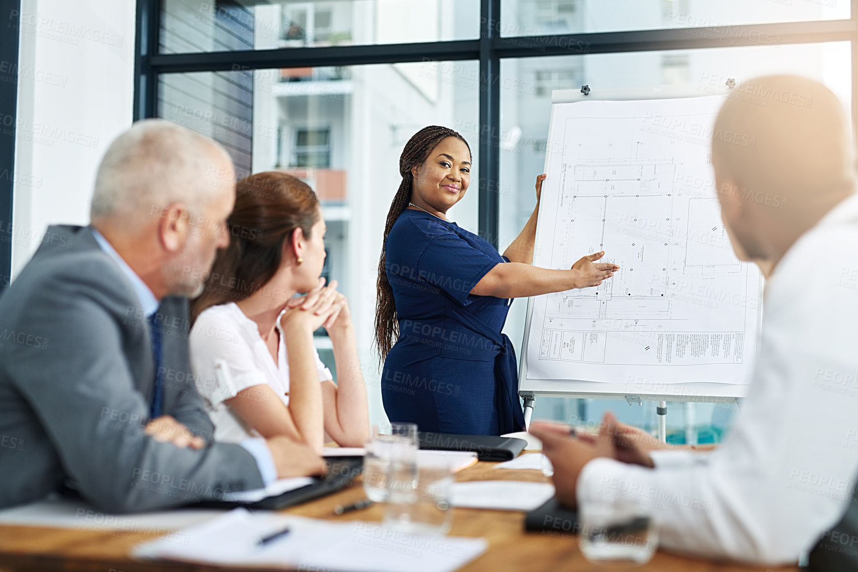 Buy stock photo Businesswoman, boardroom and meeting presentation with blueprints or remodel design, collaboration or project. Female person, floor plan and company proposal or building, development or architecture