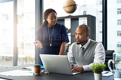 Buy stock photo Cropped shot of a young businesswoman assisting a male colleague in the office