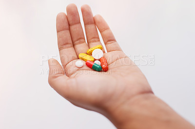 Buy stock photo Cropped shot of a hand holding an assortment of medication