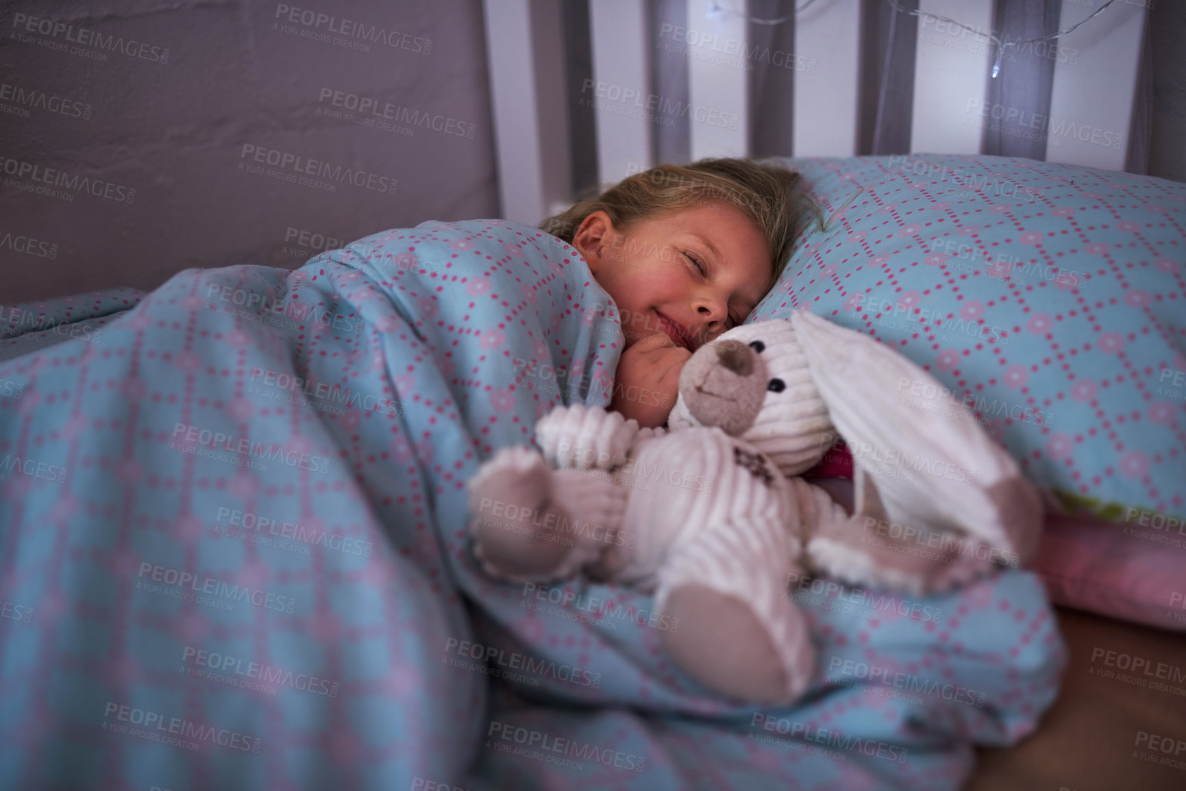 Buy stock photo Shot of a little girl sleeping in bed with her teddy bear