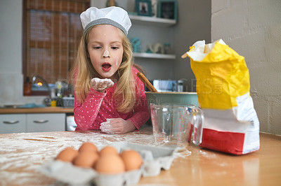 Buy stock photo Happy, child or young chef baking in kitchen for learning, practice and making dessert. Fun, chaos and girl mixing flour or ingredients in bowl with energy and excitement for home made snack