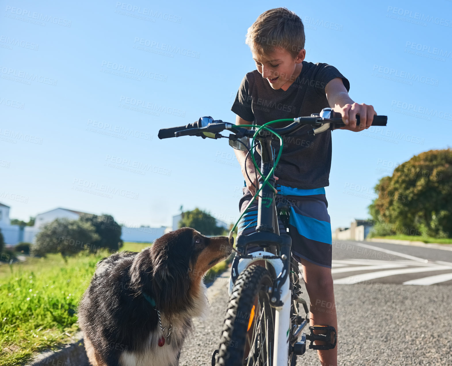 Buy stock photo Cropped shot of a young boy riding his bike outside