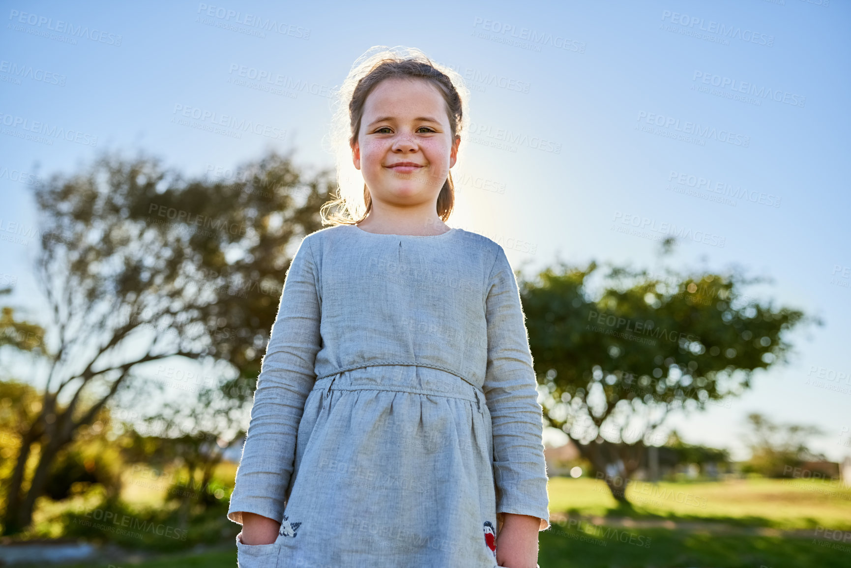 Buy stock photo Portrait of a cute little girl enjoying a day at the park
