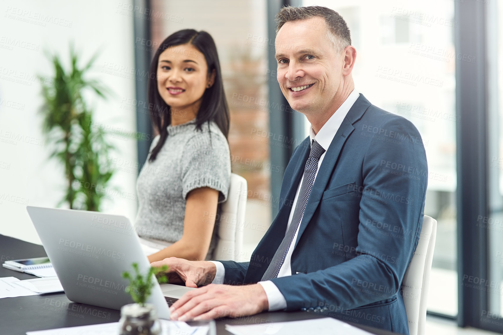 Buy stock photo Businesspeople, meeting and portrait in office with smile at desk with manager or boss for teamwork. Leadership, interview or employee check in with tech, policy and happiness in job with confidence.