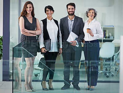 Buy stock photo Portrait of a group of businesspeople standing together in a modern office
