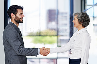 Buy stock photo Business people, handshake and meeting with deal in partnership, b2b or hiring at office. Happy businessman and woman shaking hands with smile for thank you, greeting or introduction at workplace
