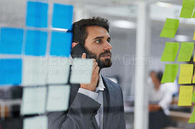 Buy stock photo Businessman, phone call and thinking with notes on glass board in brainstorming or schedule planning at office. Man or employee talking on mobile smartphone for agenda, reminder or tasks at workplace