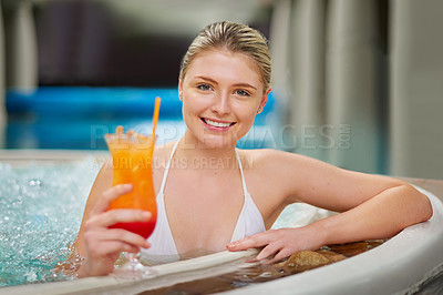 Buy stock photo Portrait of a young woman drinking a cocktail in the pool at a spa