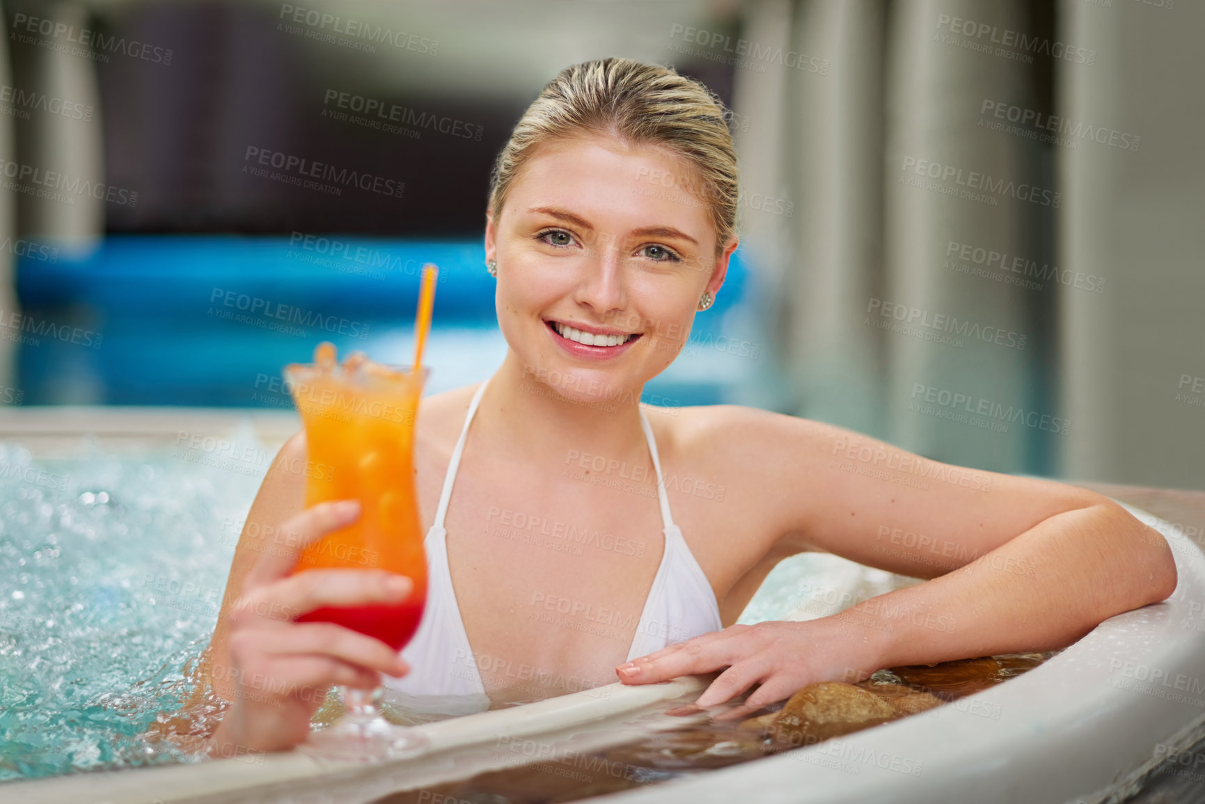 Buy stock photo Portrait of a young woman drinking a cocktail in the pool at a spa
