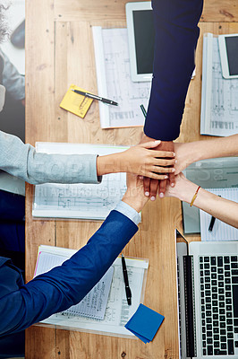 Buy stock photo Top view, business people and stack hands at table in support of goals, synergy and target of success, agreement and trust. Closeup, integration and collaboration of teamwork in a winning circle