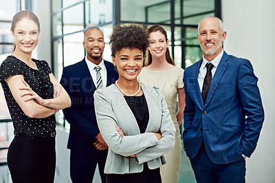 Buy stock photo Cropped portrait of a diverse group of businesspeople standing with their arms crossed in their office