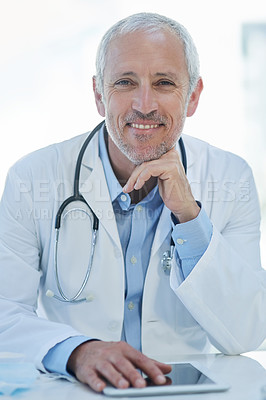 Buy stock photo Portrait, happy and mature doctor with tablet in clinic for research, information and treatment. Healthcare, technology and stethoscope in hospital for connection, medical care and smile in office