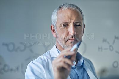 Buy stock photo Cropped shot of a male scientist drawing molecular structures on a glass wall in a lab