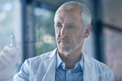 Buy stock photo Cropped shot of a male scientist drawing molecular structures on a glass wall in a lab