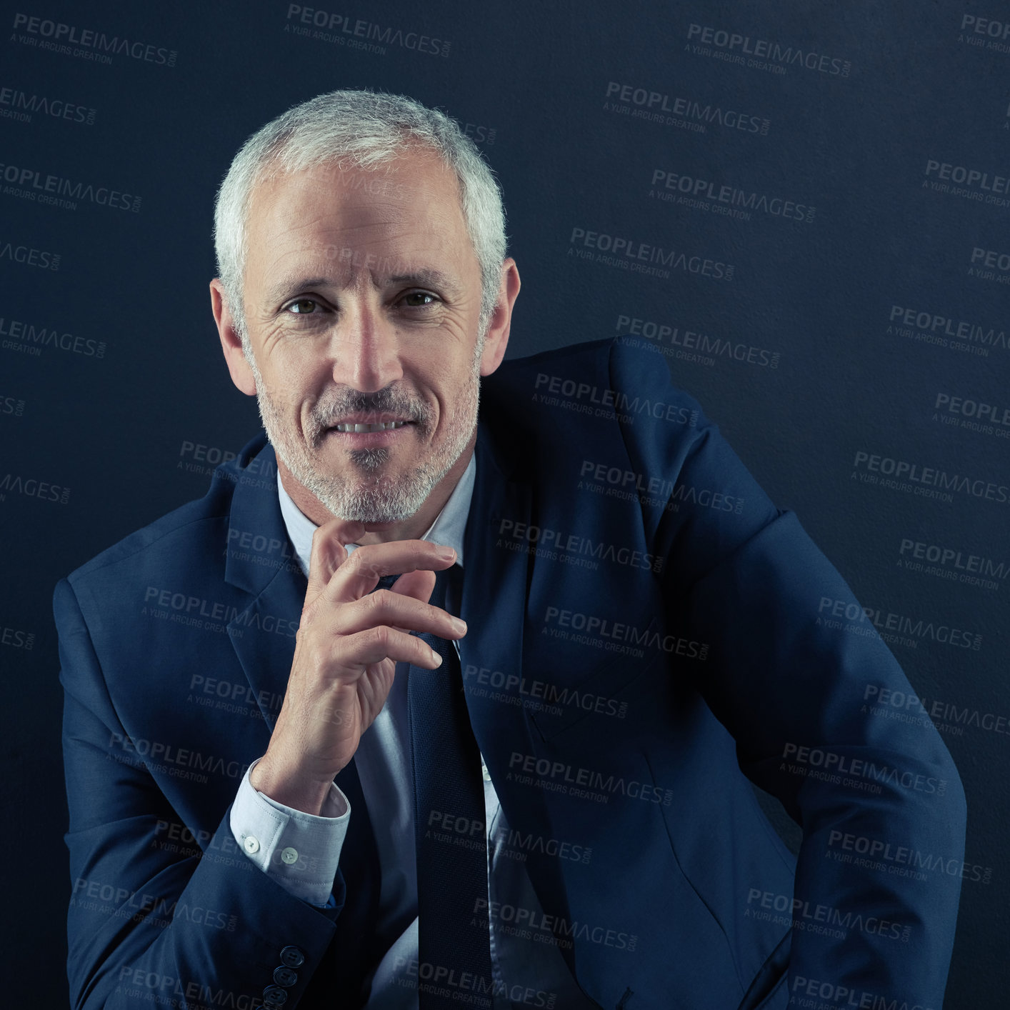 Buy stock photo Studio portrait of a mature businessman against a dark background