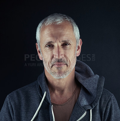 Buy stock photo Portrait of a man posing against a dark background