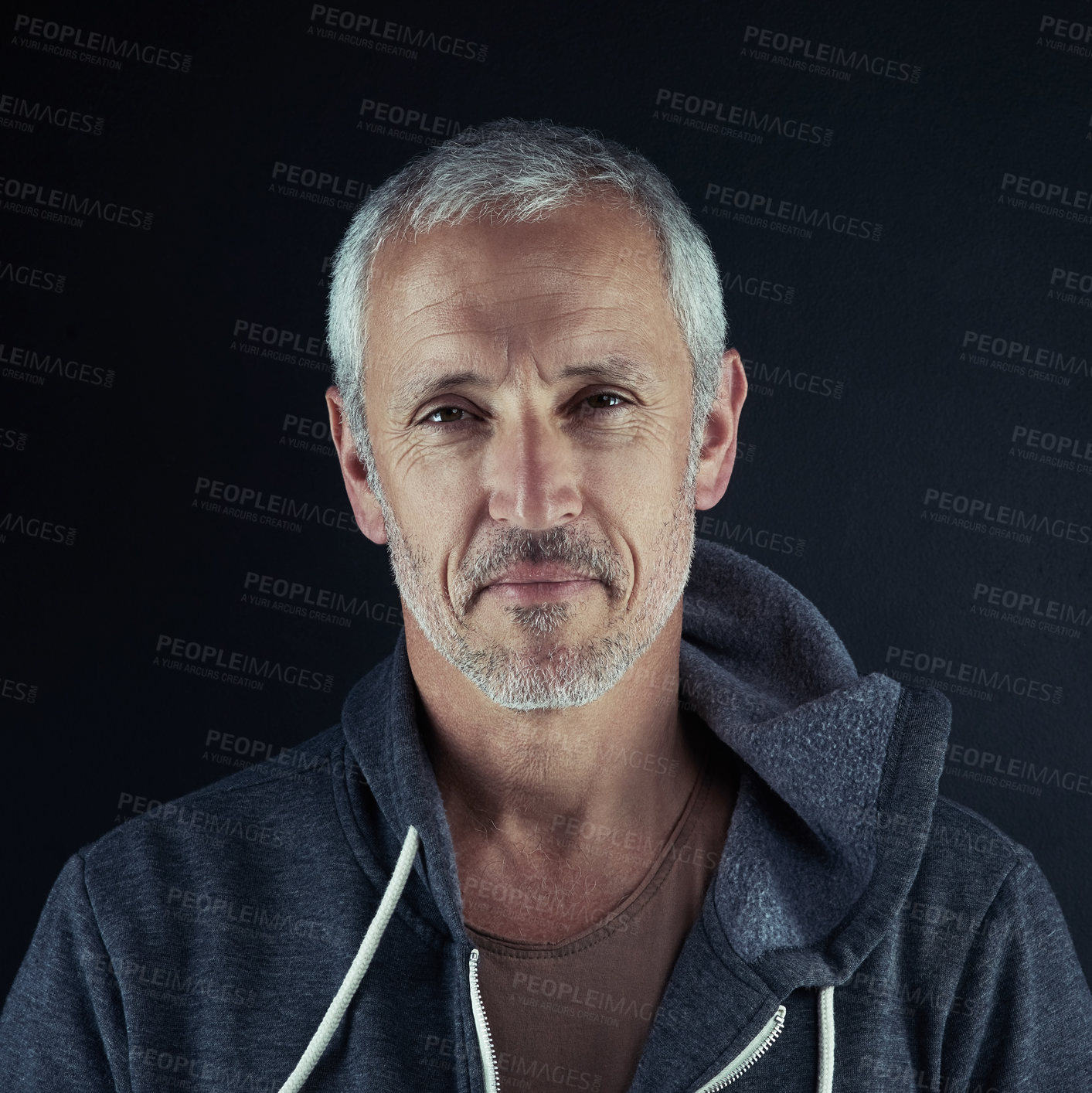 Buy stock photo Portrait of a man posing against a dark background