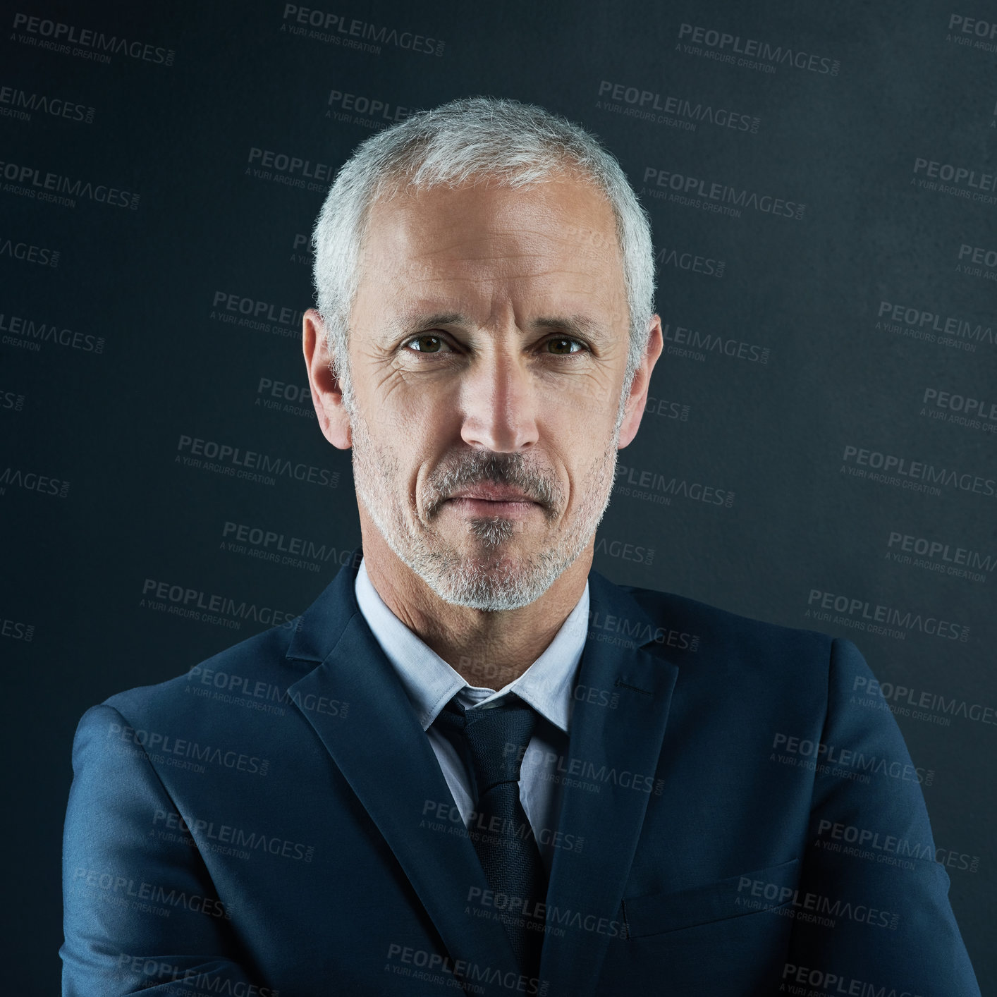 Buy stock photo Studio portrait of a mature businessman against a dark background