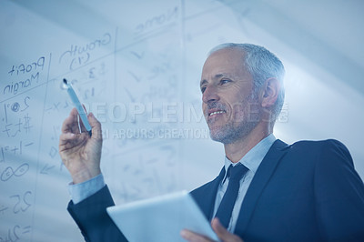 Buy stock photo Cropped shot of a mature businessman writing figures on a glass screen