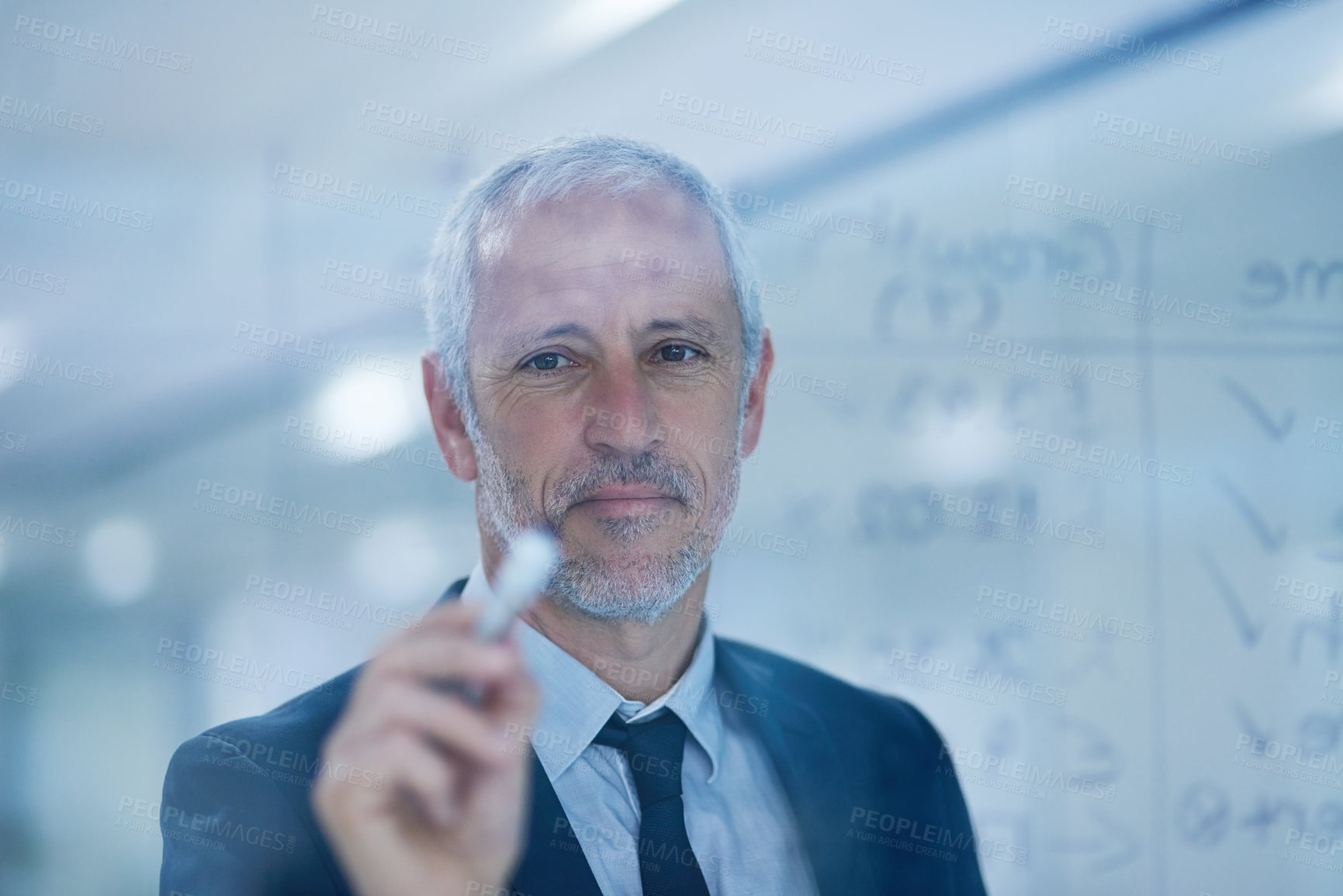 Buy stock photo Cropped shot of a mature businessman writing figures on a glass screen