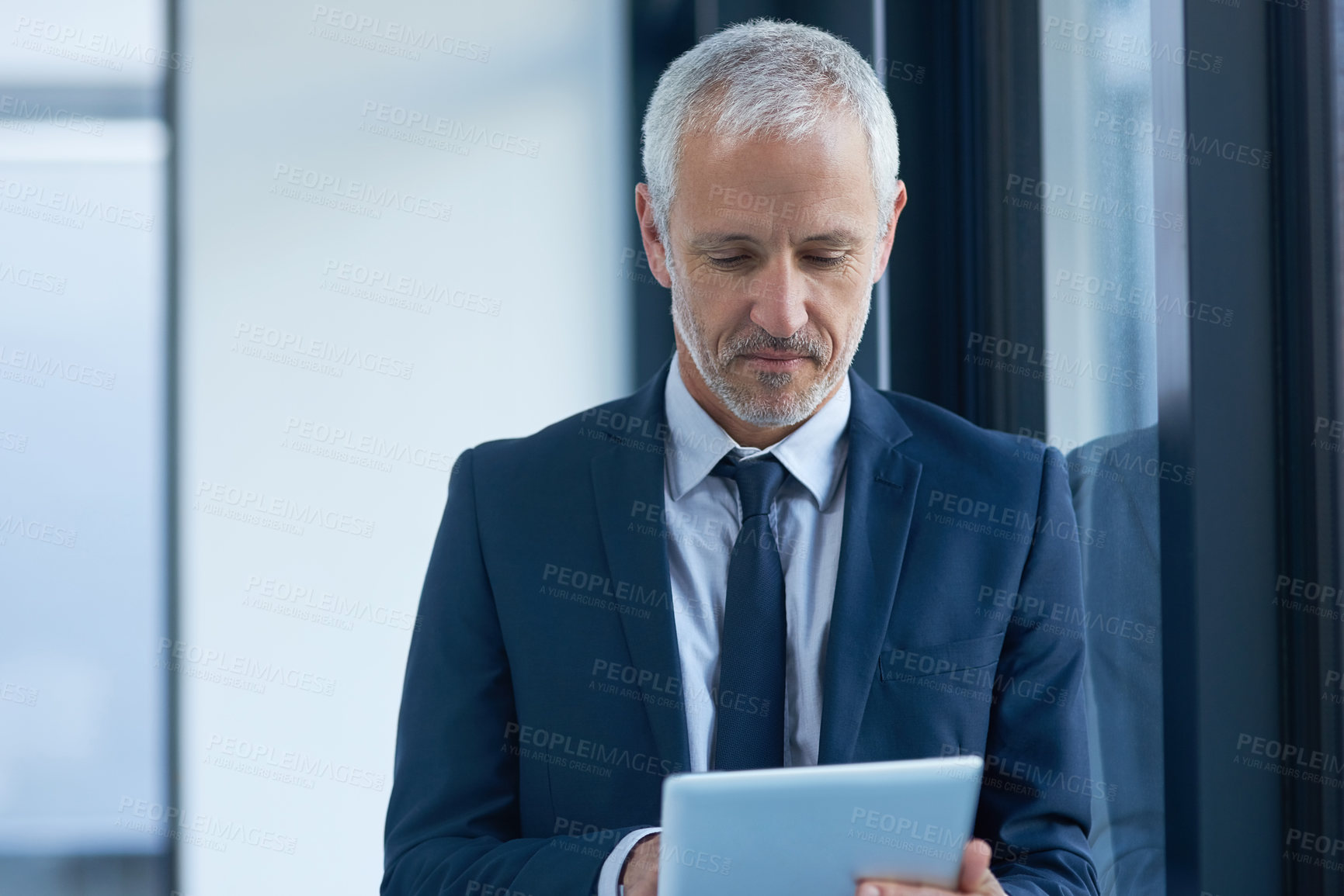 Buy stock photo Mature man, business owner and tablet in office for email, connectivity and project research. Male ceo, corporate and technology in workplace for communication, reading and online for internet