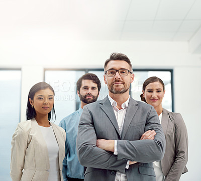 Buy stock photo Portrait of a group of businesspeople standing together in a modern office