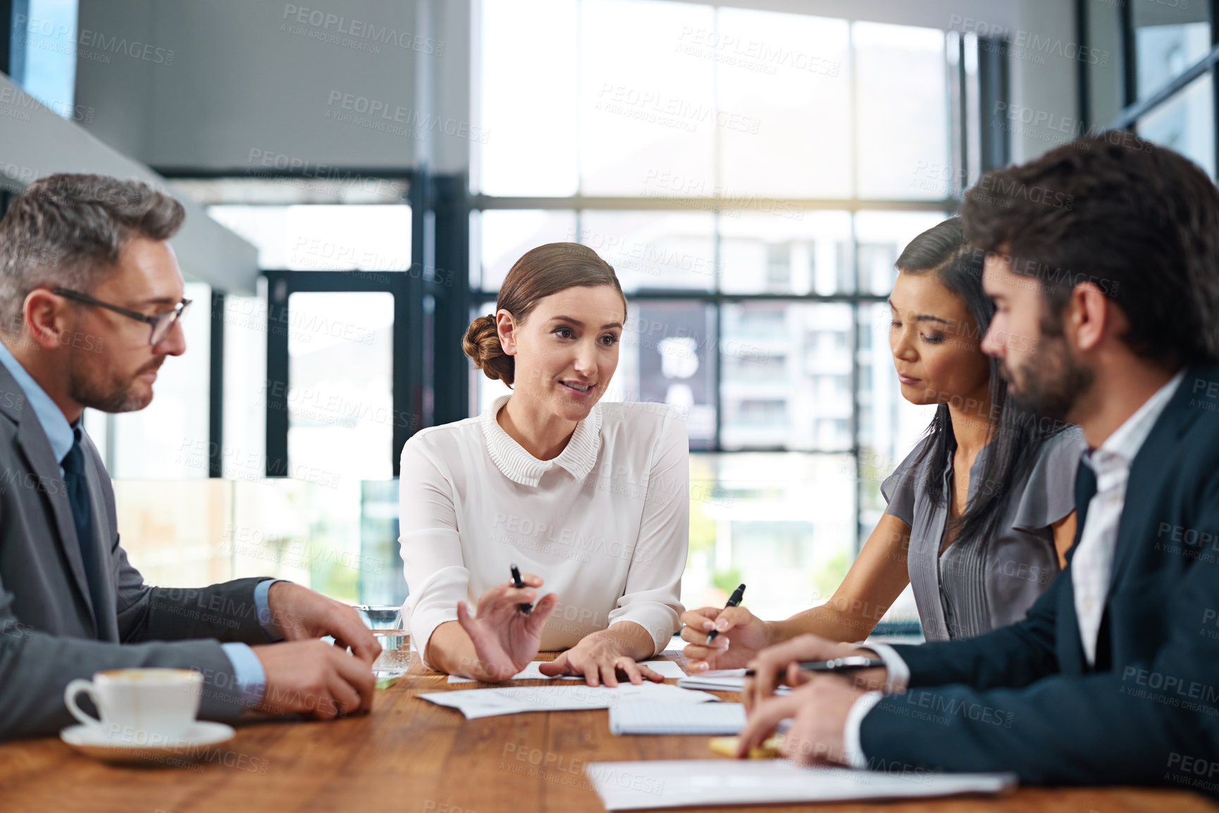 Buy stock photo Corporate, business and meeting in workplace for planning, project and international company. Collaboration, diversity and people at desk for paperwork, executive and conference for discussion.