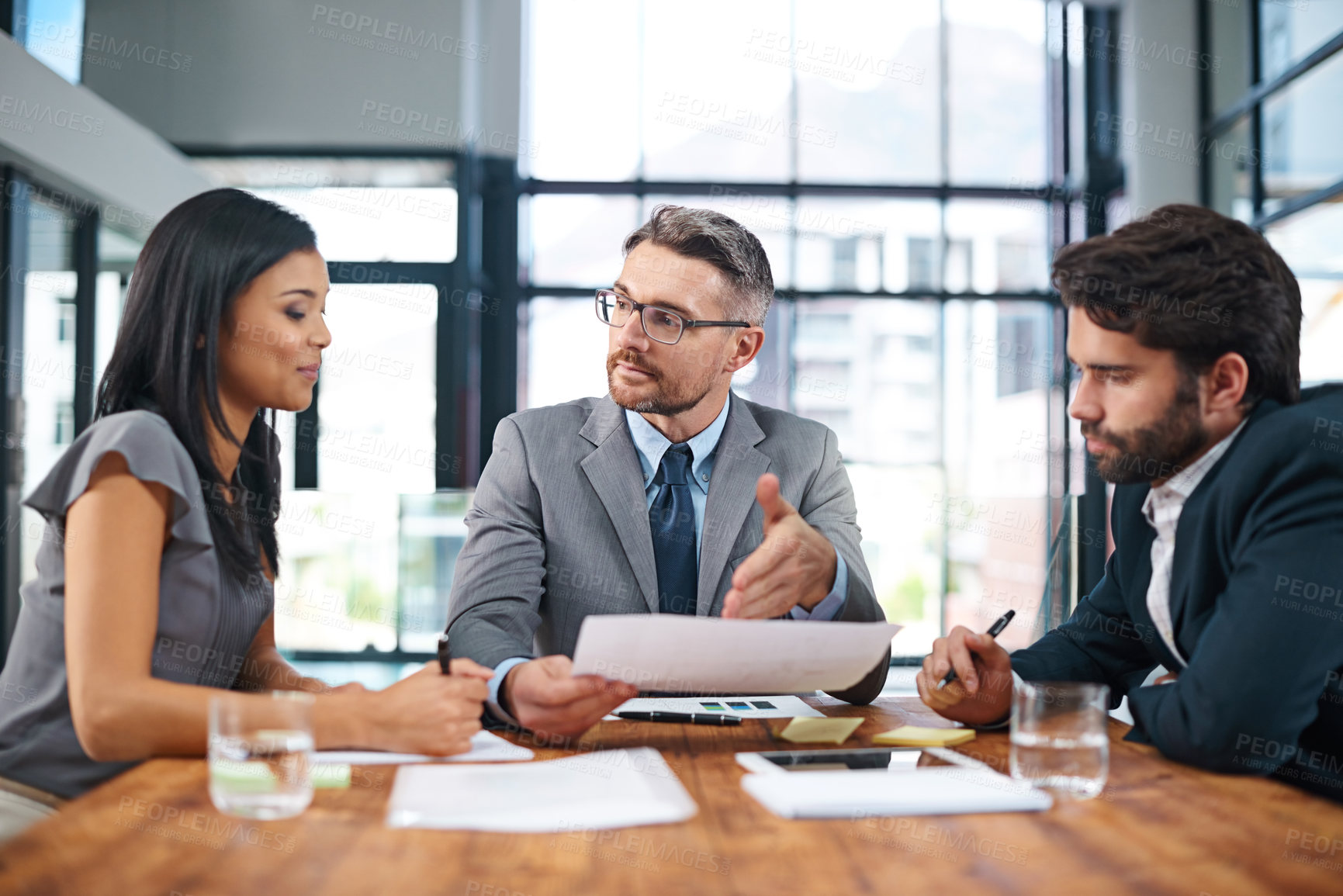 Buy stock photo Business meeting, diversity and review in office for finance, paperwork and growth for company or investment. Financial manager, conference and planning with team in workplace for profit or strategy