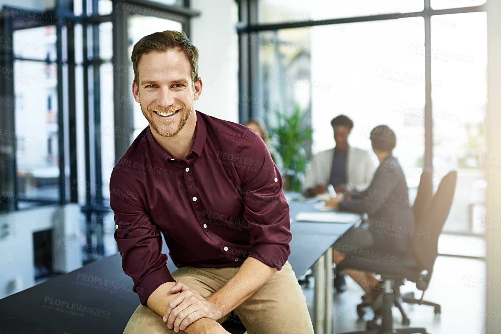 Buy stock photo Business man, meeting and confidence portrait with public relations worker and team in office. Startup, employee and table at company with smile in job boardroom with speaker ready for training 