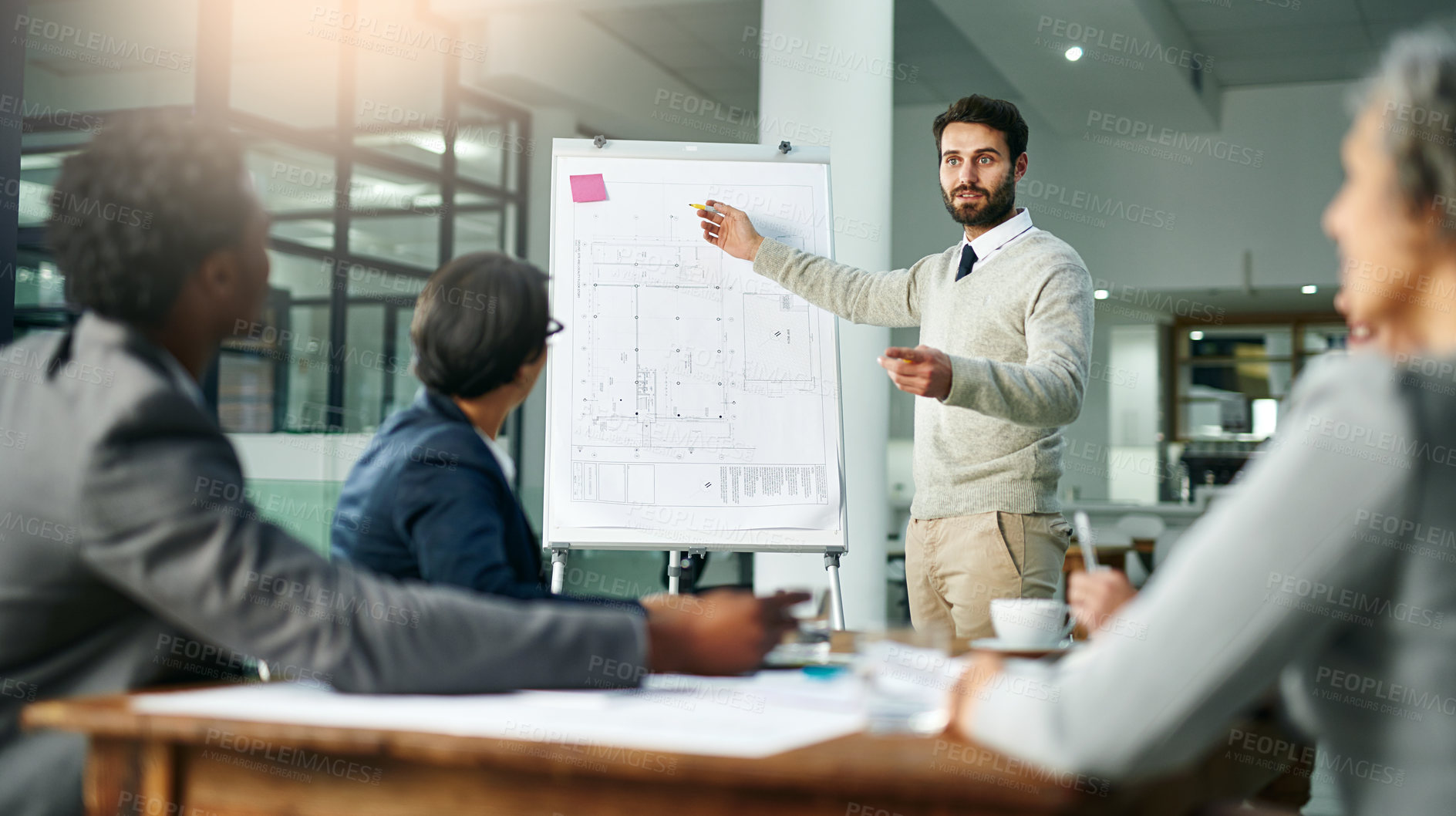 Buy stock photo Cropped shot of a young businessman giving a presentation in the boardroom