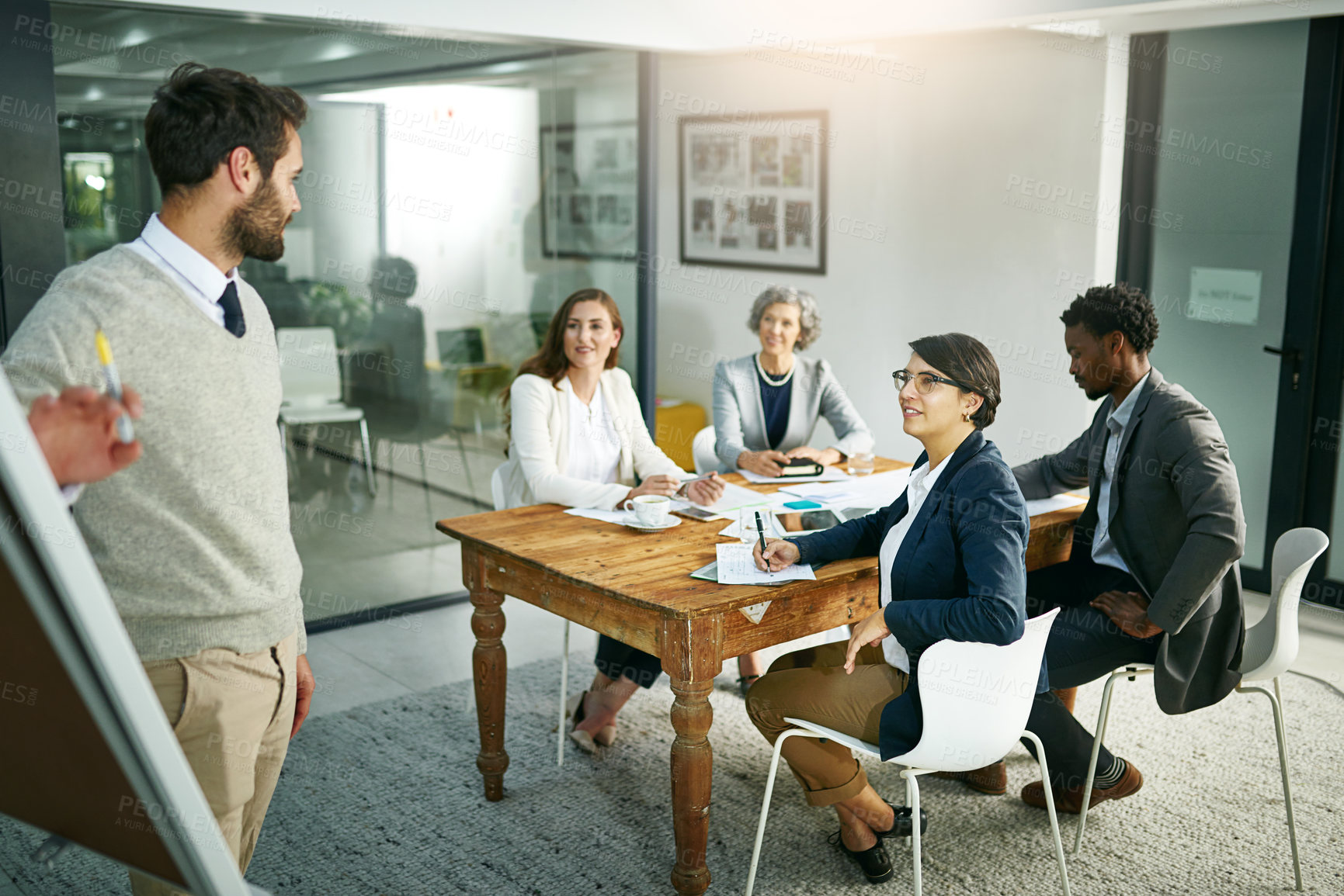 Buy stock photo Cropped shot of a young businessman giving a presentation in the boardroom