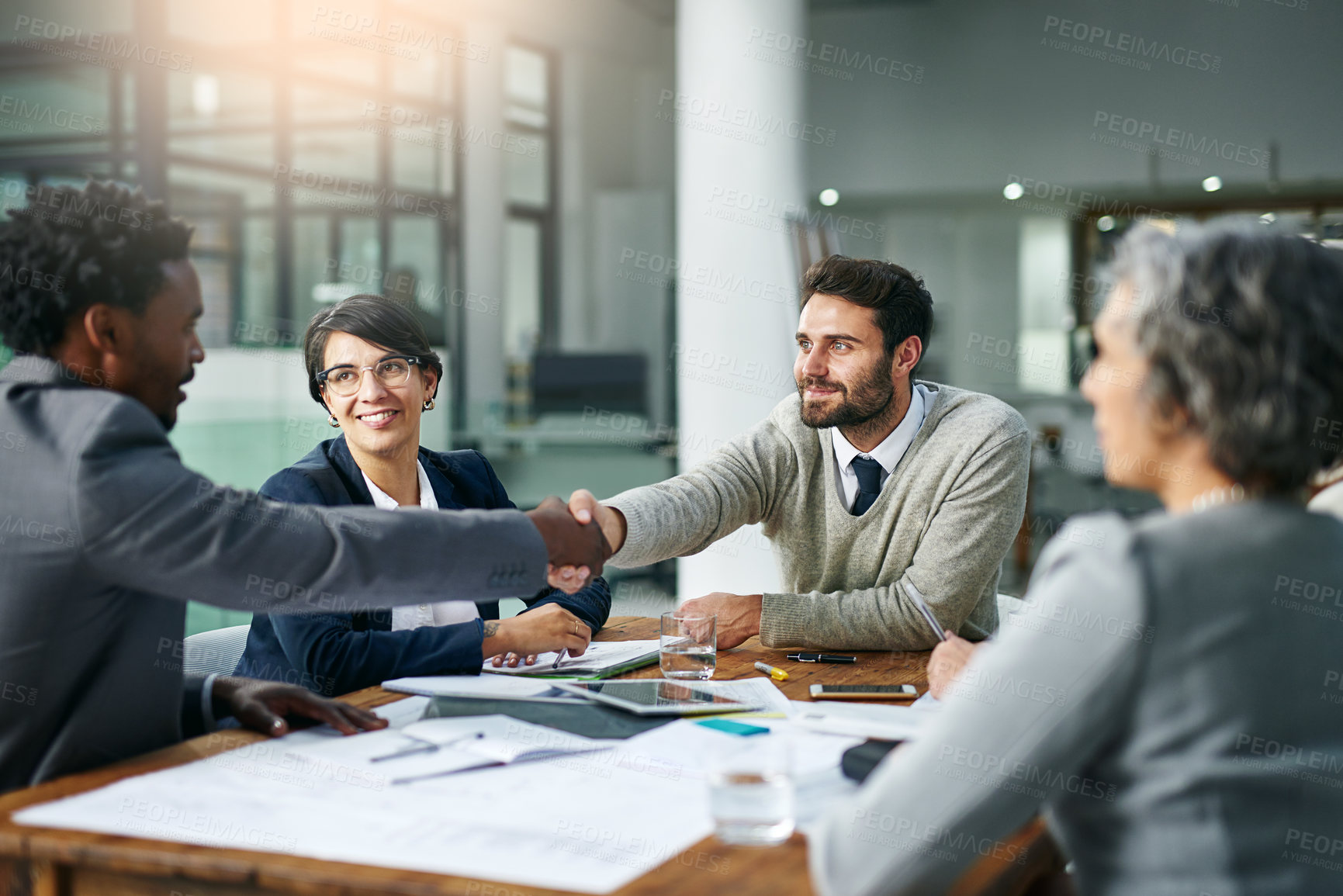 Buy stock photo Team, diversity and partnership in handshake for business, development and project management in corporate with tech. Group, agreement and deal for ideas, strategy and collaboration for contract