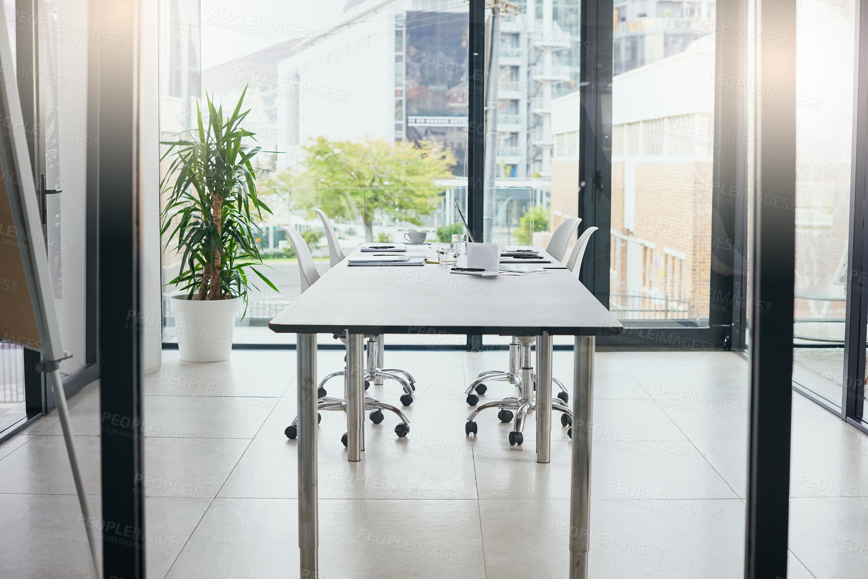 Buy stock photo Shot of an empty boardroom furnished with a table and chairs