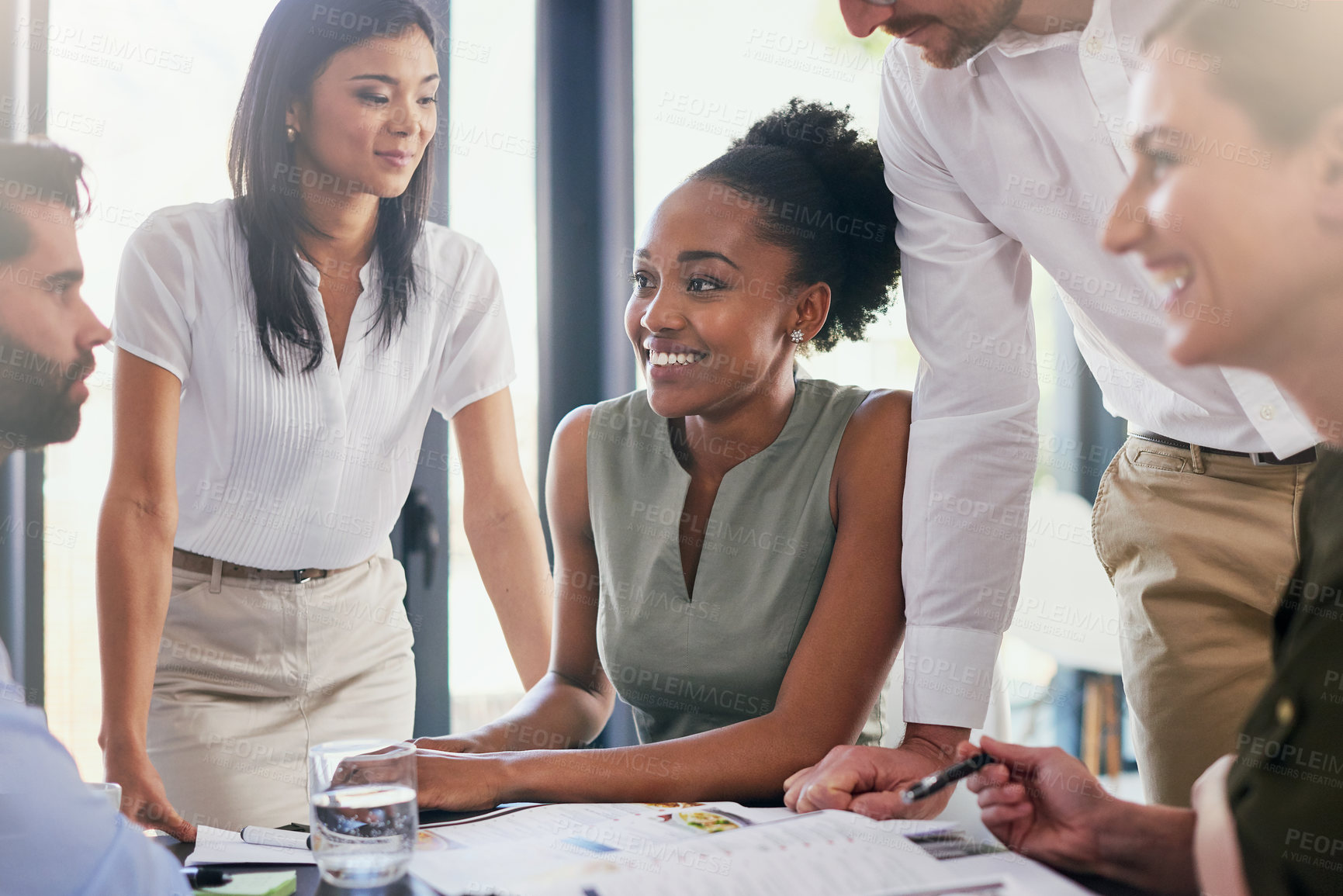 Buy stock photo Cropped shot of a group of diverse businesspeople having a meeting in the boardroom