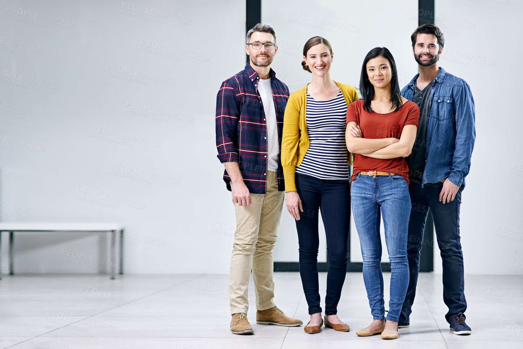 Buy stock photo Portrait of a group of creatives standing together in an office