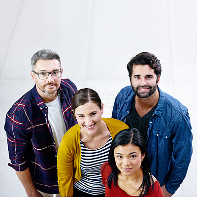 Buy stock photo High angle shot of a group of creatives standing together in an office