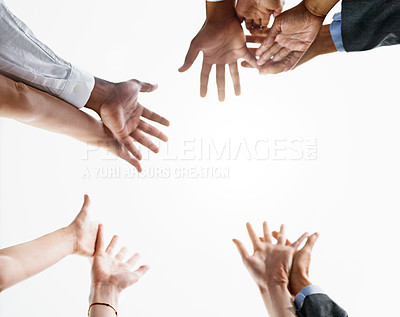 Buy stock photo Closeup shot of a group of businesspeople about to join their hands together in unity