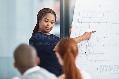Buy stock photo Cropped shot of a businesswoman giving a presentation to her colleagues in a boardroom