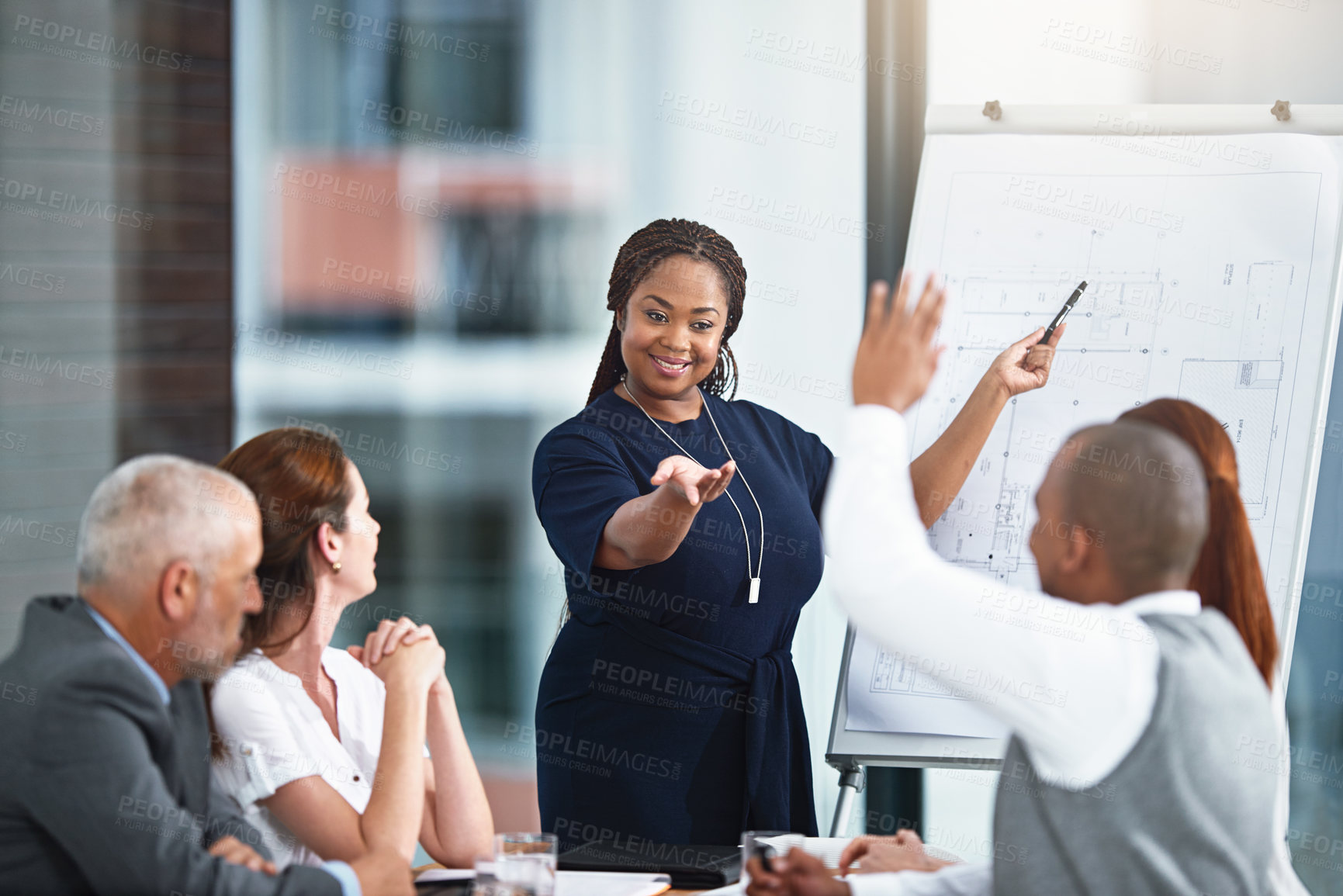 Buy stock photo Cropped shot of a businesswoman giving a presentation to her colleagues in a boardroom