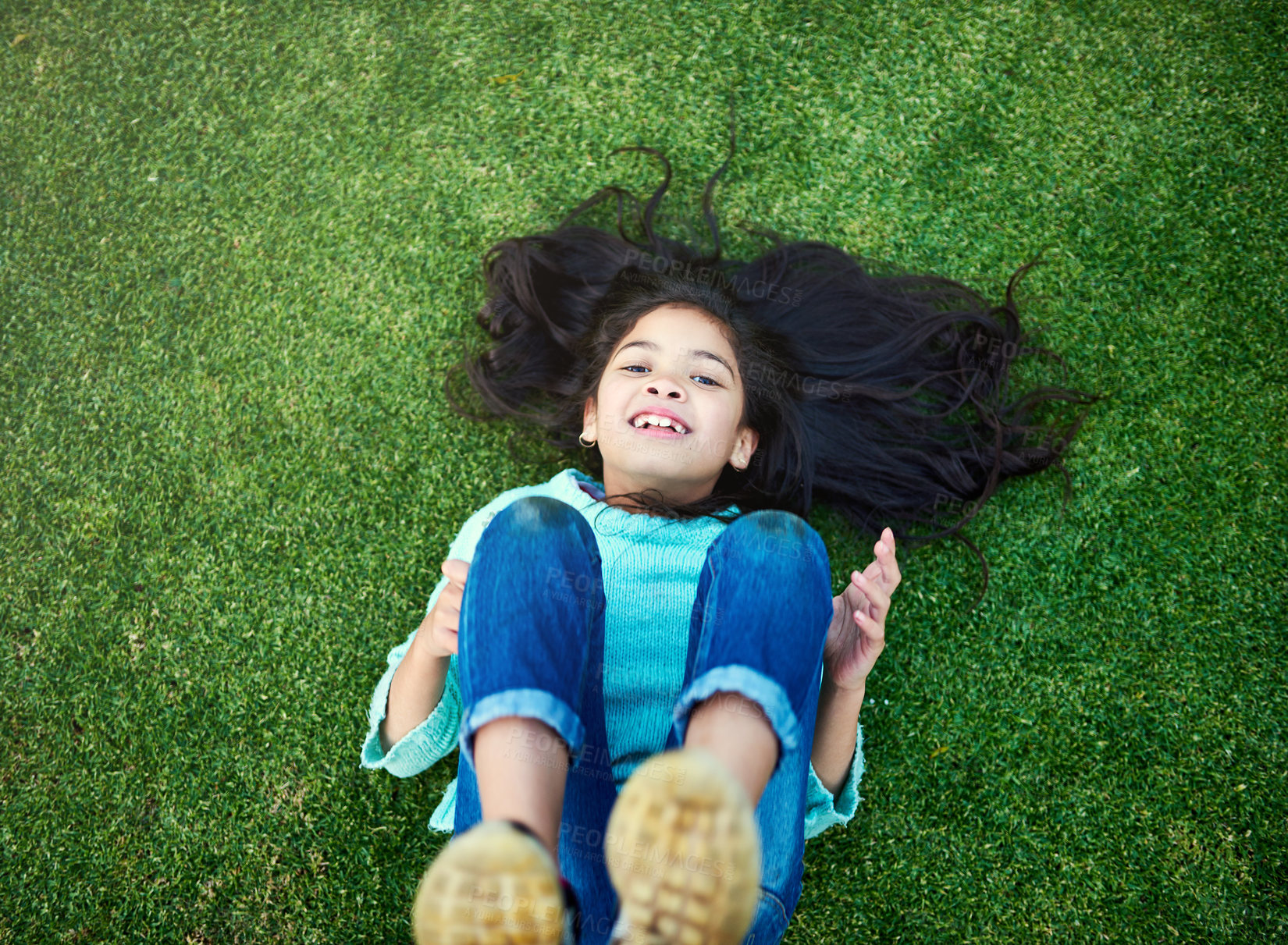 Buy stock photo Portrait, child and grass with smile for resting in park with happy on weekend in nature or garden. Girl, development and green in summer with backyard or vacation in childhood with freedom.