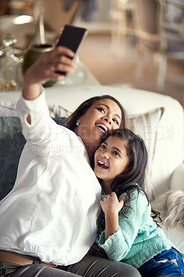 Buy stock photo Selfie, mother and girl in home happy for social media, family memory and bonding together. Smile, parent and daughter with picture for fun on break, school holiday or relationship with love