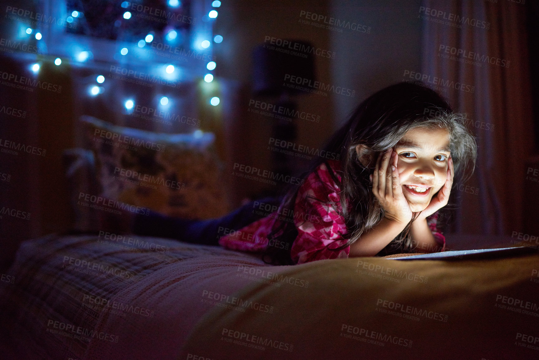 Buy stock photo Night, smile and tablet with portrait of girl in bedroom of home for gaming or watching movie. Bed, internet and technology with happy young child in apartment for evening browsing or entertainment