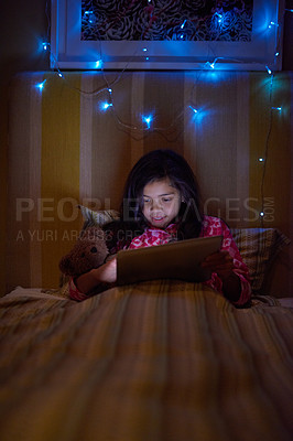 Buy stock photo Girl, kid and home with tablet at night with online games for education, learning and child development. Bedroom, smile and streaming platform or service with movies, cartoon and entertainment